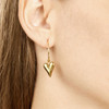 18Kt gold-plated heart hoop earrings on a model close-up. 