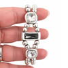 Gray and clear Swarovski crystal silver-plated bracelet in my hand. 