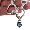 Blue heart crystal silver-plated toggle bracelet in my hand.  