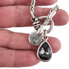 Teardrop gray Swarovski crystal silver-plated toggle bracelet in my hand. 