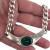 Emerald green Swarovski crystal chain necklace in my hand.