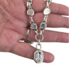 Clear crystal silver-plated necklace in my hand. 