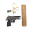 Rhinestone gun keychain with a ruler. 