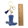 Blue rhinestone cowboy boot keychain with a ruler. 