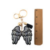 Rhinestone wings keychain with a ruler. 