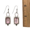 Pink Swarovski crystal dangle earrings with a ruler. 