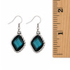 Blue crystal dangle earrings with a ruler. 