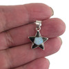 Sterling silver five-point star pendant with black Onyx and shimmering Opal inlay, handcrafted in New Mexico, USA in my hand.