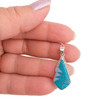 Sterling Silver kite-shaped pendant with Kingman Turquoise and Opal geometric inlay handcrafted in New Mexico, USA, in my hand.