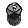 Interior view of leopard-print baseball cap showing black mesh construction and elastic crisscross ponytail opening.