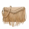 Ampere tan boho fringe crossbody purse featuring decorative metal grommets, woven trim, long fringe accents, textured leather-look material, and adjustable shoulder strap.