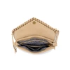 Interior of Ampere tan Western fringe crossbody purse featuring black and white geometric print lining, multiple storage compartments, center zippered pocket, and magnetic snap flap.