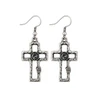 Pair of silver-plated open cross earrings featuring faceted dark gray charcoal crystals, textured silver finish, and decorative wire-wrapped accents.