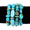 Collection of turquoise nugget stretch bracelets displayed on black velvet, showcasing vibrant blue and aqua stones, assorted polished shapes, and Southwestern style.