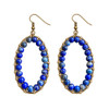 Close-up of Calista Blue Beaded Oval Drop Earrings featuring rich cobalt blue and denim blue stone beads with natural color variations, intricate gold-tone wire wrapping, and antique bronze fishhook ear wires.