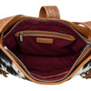 Interior view of Myra Bag Loyal West Desert Trail Cowhide Shoulder Bag showcasing rich burgundy fabric lining, spacious main compartment, interior zippered pocket, slip pockets, and brown leather trim.