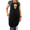 Colorful Sugar Skull design on the front of a black cotton apron. 
