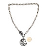 Moon and stars necklace with skull CZ clasp with quarter to show size. 