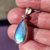 In the sun with the blue-purple flash on Labradorite sterling silver pendant. 