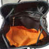 Inside of leopard leather packpack. 