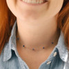 Lapis celestial necklace by Soulku on a woman's neckline. 