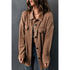 Model tan brown oversized textured knit button front shacket. 