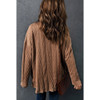 Backside of tan brown oversized textured knit button front shacket. 