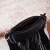 Inside Wrangler black studded fringe crossbody purse. 