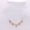 Raw Citrine silver necklace on white neck. 