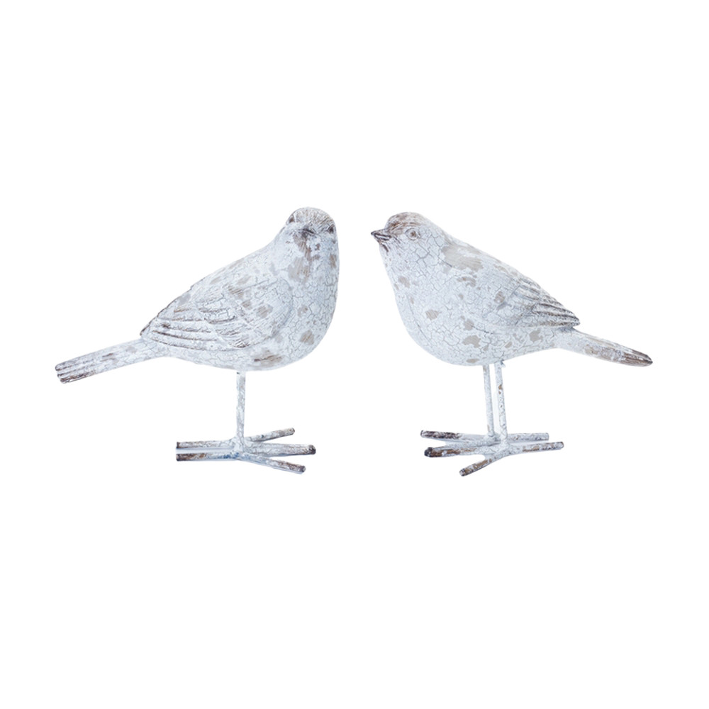 Weathered bird figurines.