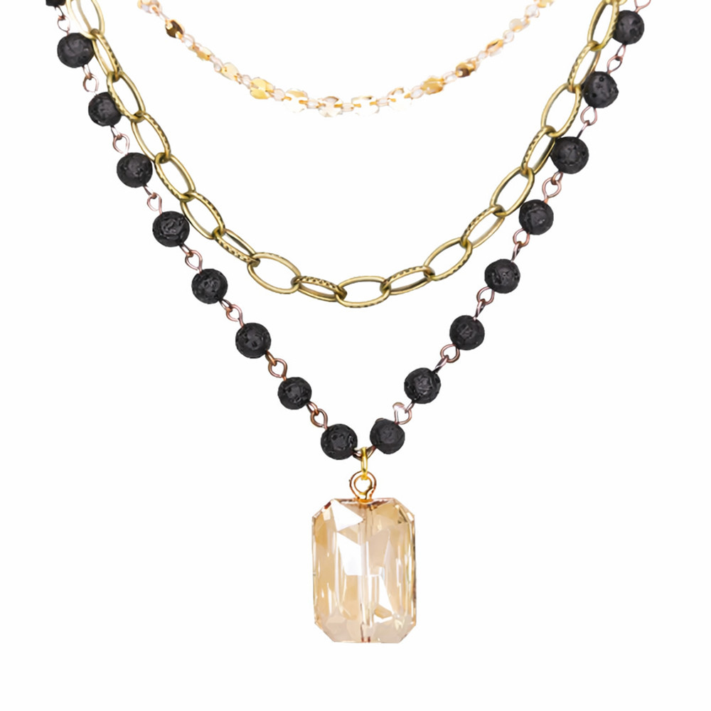 Multi-chain black beaded necklace with a crystal charm. 