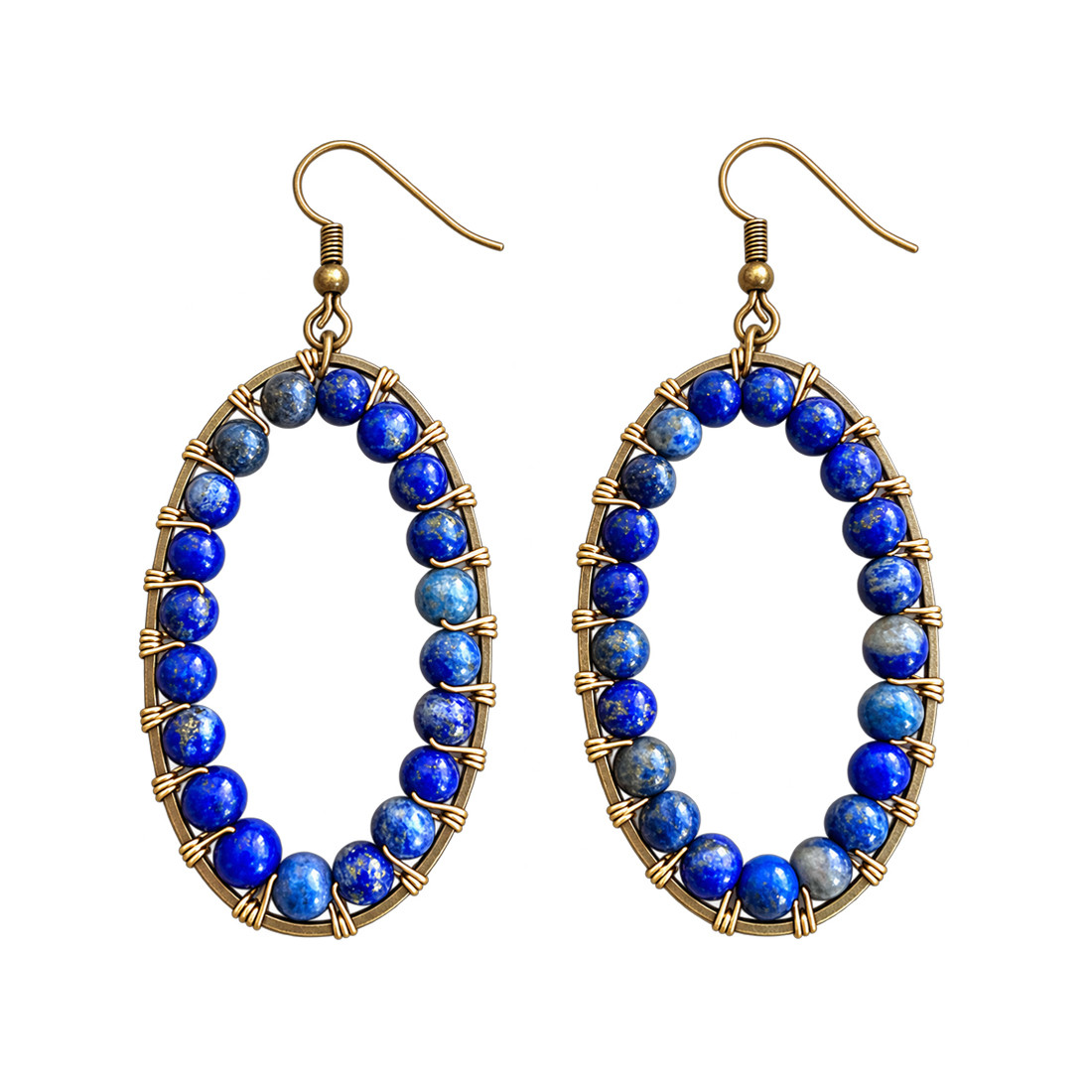 Close-up of Calista Blue Beaded Oval Drop Earrings featuring rich cobalt blue and denim blue stone beads with natural color variations, intricate gold-tone wire wrapping, and antique bronze fishhook ear wires.