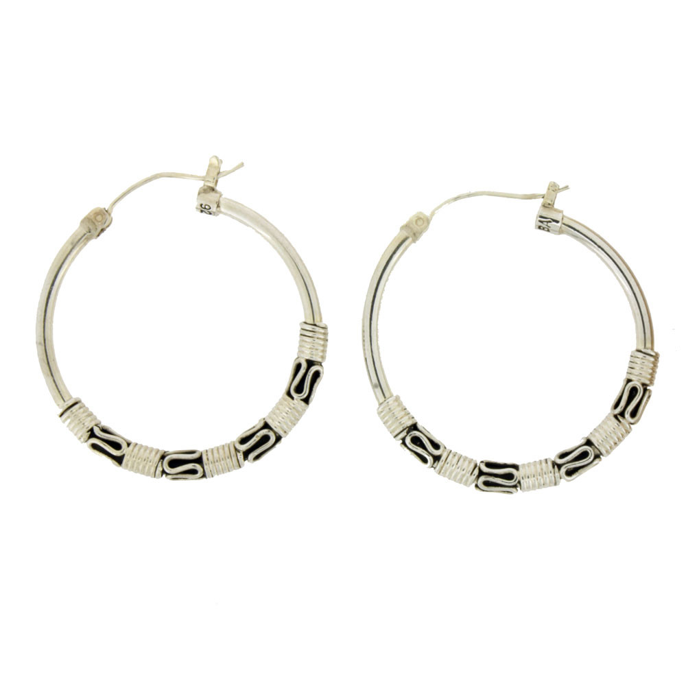 Sterling silver hoop earrings with Bali detail.