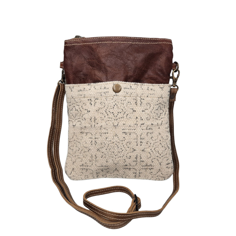 Front side of canvas, twill and leather purse. 