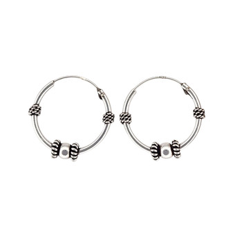 20mm Bali-style hinged sterling silver hoops.
