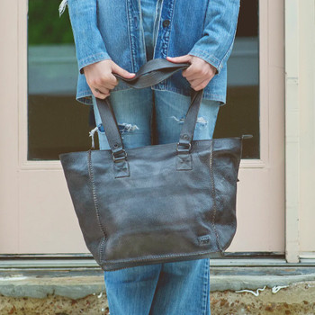 Black rustic Celindra LTC BedStu shoulder bag with a model. 