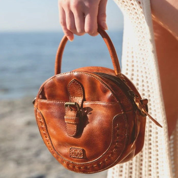 Arenfield round crossbody purse Pecan DD leather on a model. 