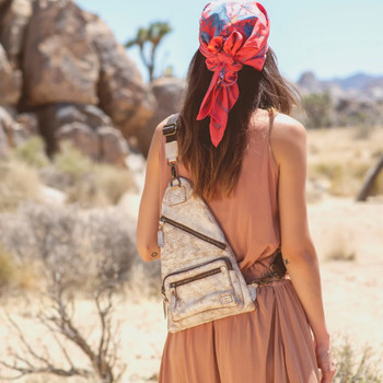 Nectar Lux BedStu leather crossbody sling bag on a model. 