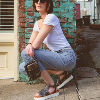 Black Lux Alelike BedStu crossbody purse with a model. 