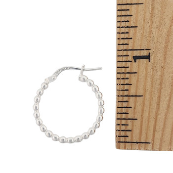 Oval bead hoop earrings 15mm with a ruler.  