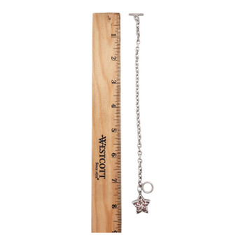 Rhodium-plated sterling silver star charm bracelet next to a ruler. 