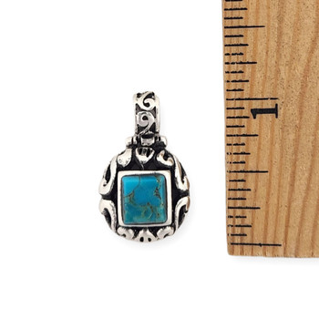 Bali-style turquoise stone sterling silver pendant with a ruler.  Bali-style turquoise stone sterling silver pendant with a ruler.