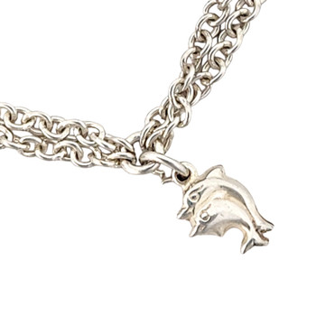 Sterling silver dolphin charm bracelet close-up. 