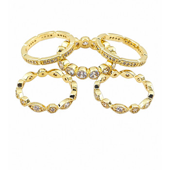 Five stackable 14kt gold-plated rings separate. 