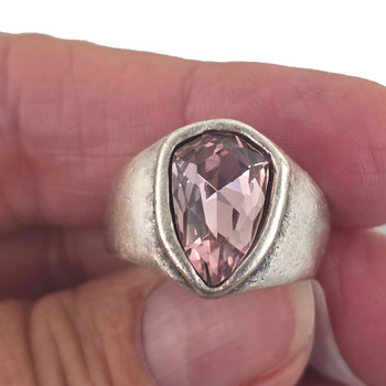 Pink .crystal silver-plated adjustable ring in my hand. 