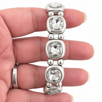 Clear Swarovski crystal silver-plated bracelet in my hand. 