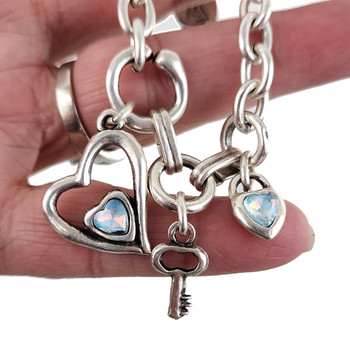 Heart and key charm bracelet with crystals in my hand. 