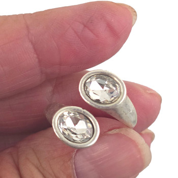 Two-stone adjustable silver-plated ring in my hand. 