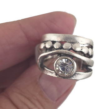 Clear Swarovski crystal adjustable ring in my hand. 