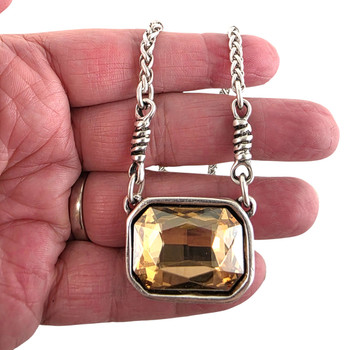 Yellow champagne large rectangle crystal chain necklace in my hand. 